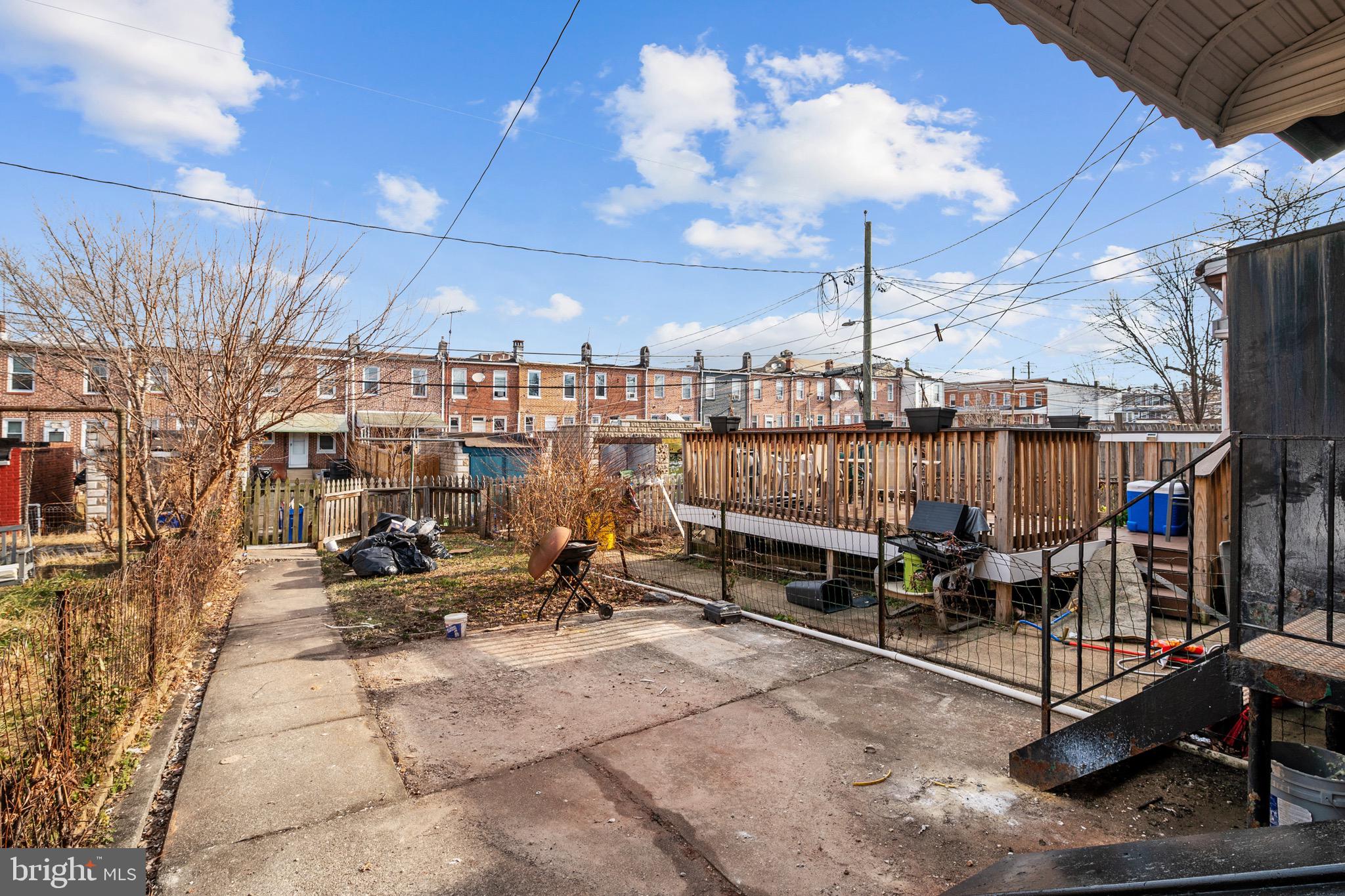 2828 Lake Avenue Baltimore, MD 21213 - Photo 27 of 28 a view of a patio with a table and chairs