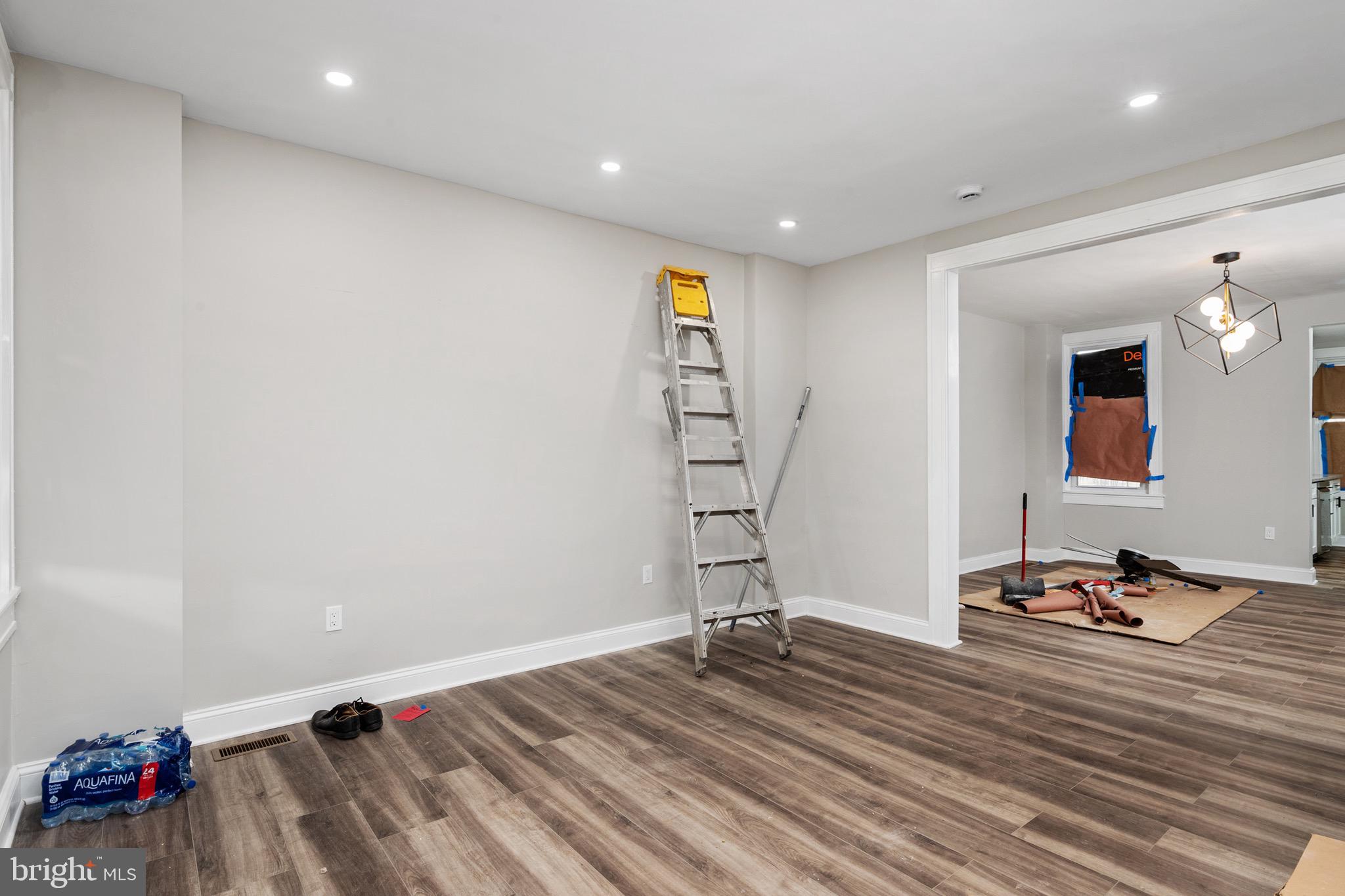 2828 Lake Avenue Baltimore, MD 21213 - Photo 4 of 28 a room with a bed and a mirror