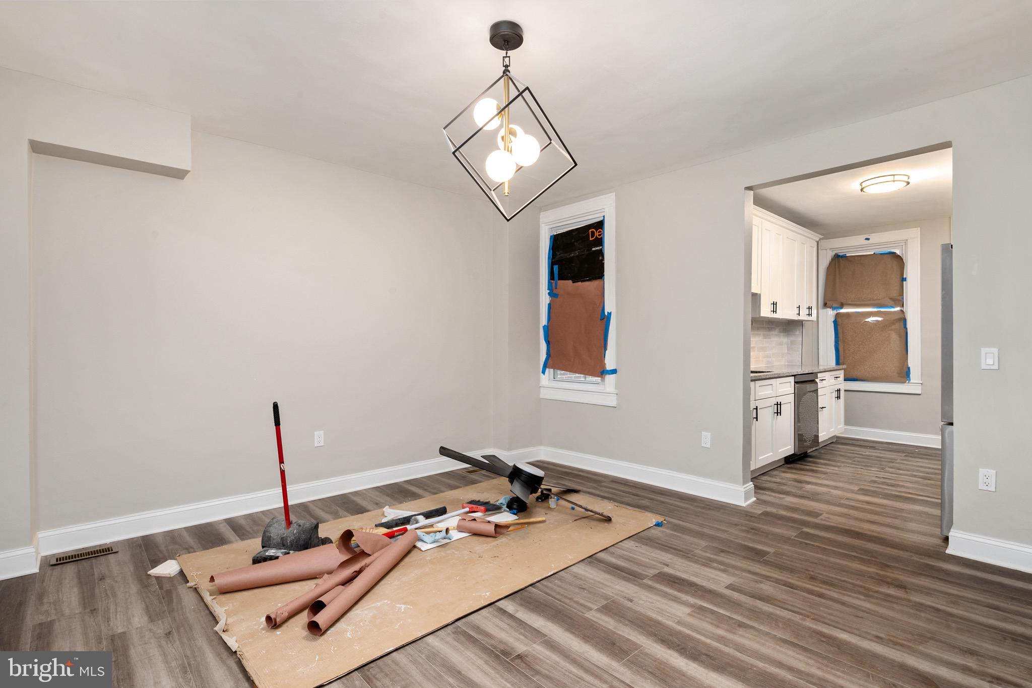 2828 Lake Avenue Baltimore, MD 21213 - Photo 7 of 28 a living room with furniture and a wooden floor