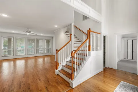 a view of an entryway with wooden floor