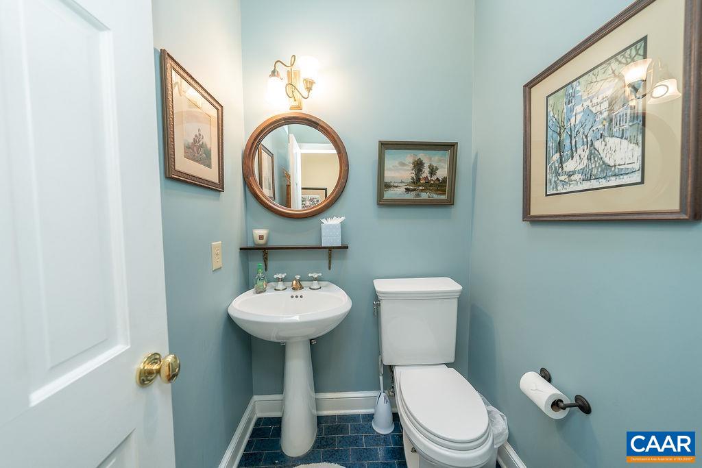 5540 Laurel Ridge Road Charlottesville, VA 22911 - Photo 25 of 68 a bathroom with a toilet a sink and mirror