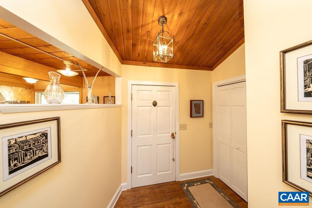 5540 Laurel Ridge Road Charlottesville, VA 22911 - Photo 3 of 68 a view of a hallway with wooden floor and a bathroom