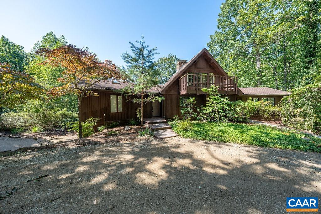 5540 Laurel Ridge Road Charlottesville, VA 22911 - Photo 49 of 68 a front view of a house with a yard and trees