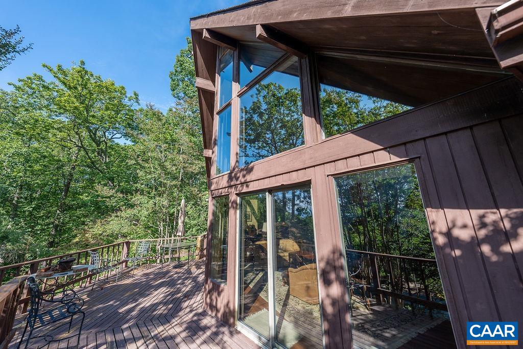 5540 Laurel Ridge Road Charlottesville, VA 22911 - Photo 60 of 68 a view of a patio with table and chairs under an umbrella