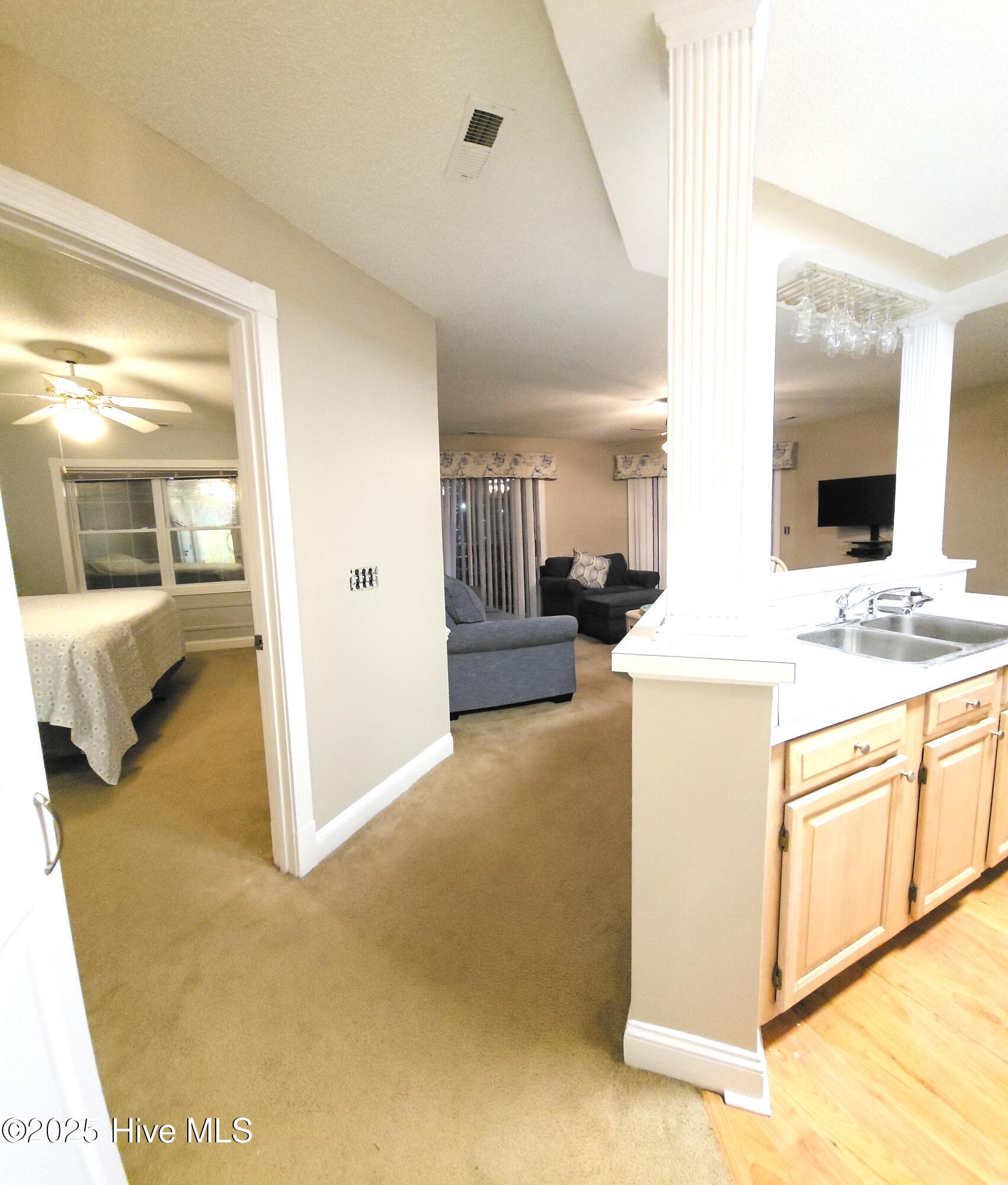 908 Resort Circle, Unit 108 Sunset Beach, NC 28468 - Photo 17 of 36 into greatroom from hall
