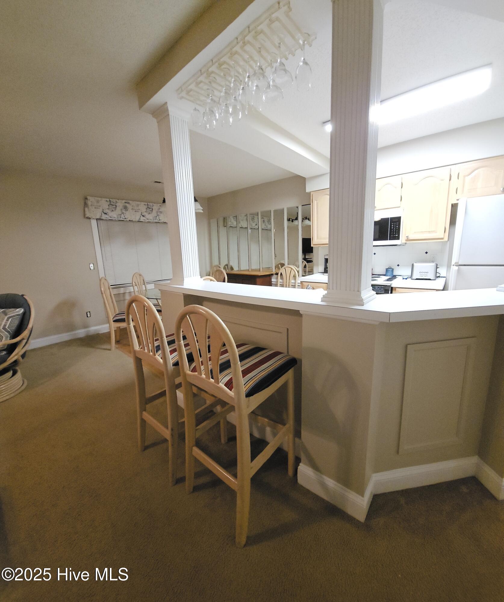 908 Resort Circle, Unit 108 Sunset Beach, NC 28468 - Photo 18 of 36 breakfast bar