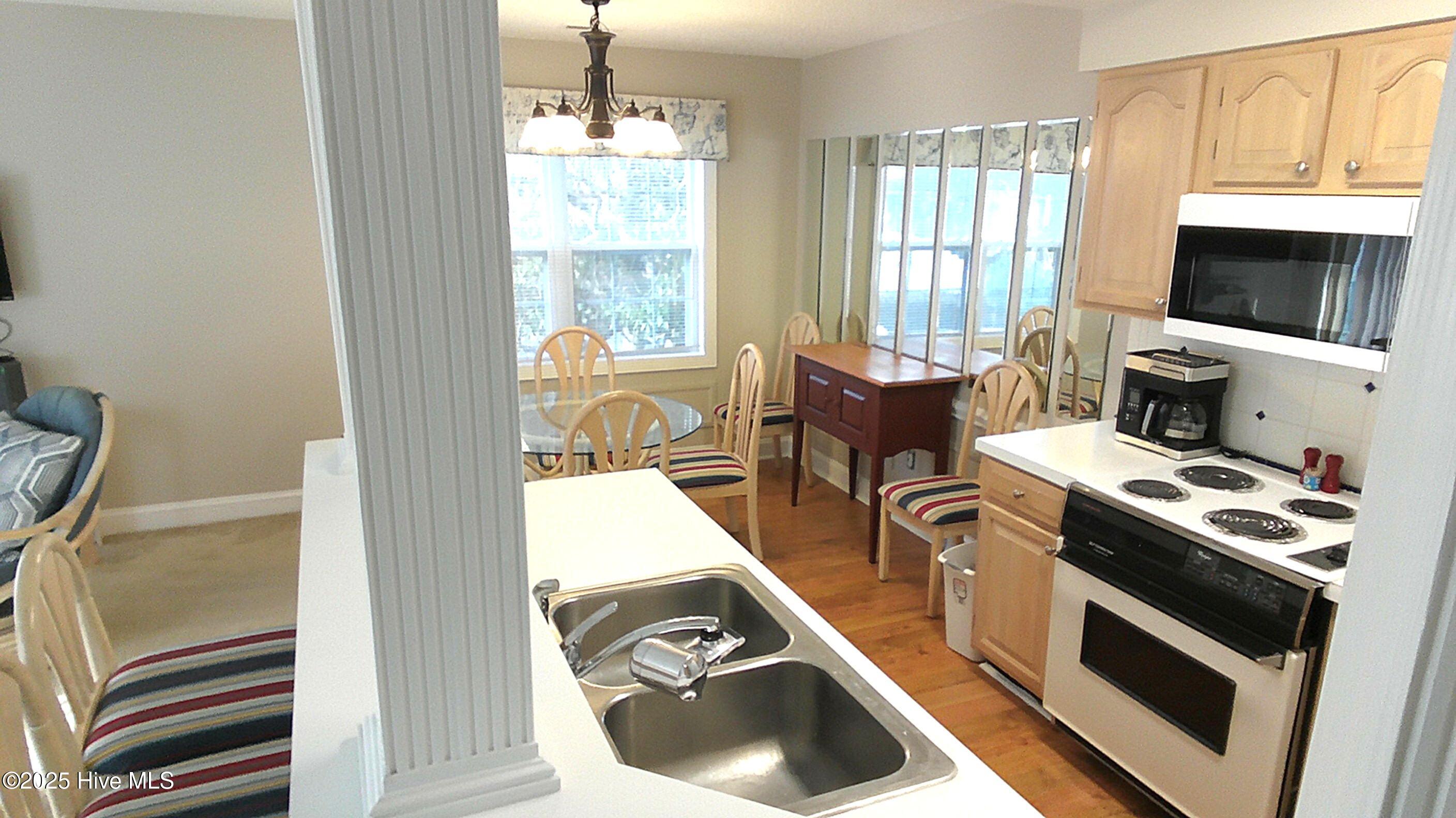 908 Resort Circle, Unit 108 Sunset Beach, NC 28468 - Photo 20 of 36 kitchen from hall