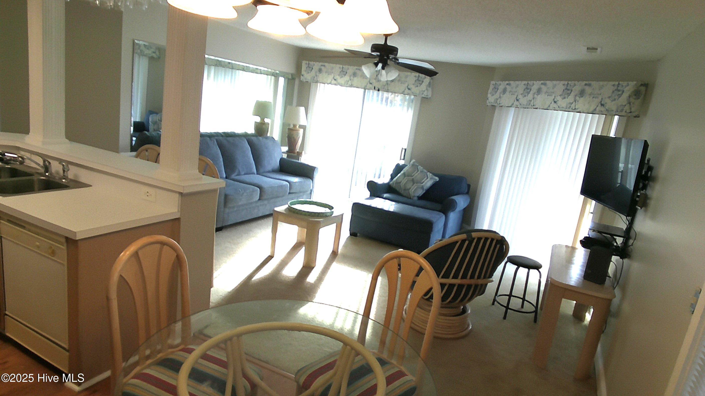 908 Resort Circle, Unit 108 Sunset Beach, NC 28468 - Photo 24 of 36 dining to livingroom