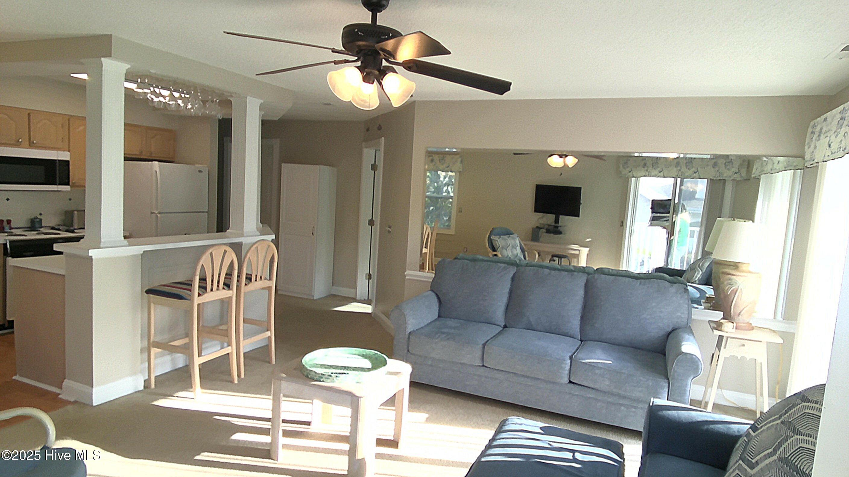 908 Resort Circle, Unit 108 Sunset Beach, NC 28468 - Photo 27 of 36 livingroom from balcony