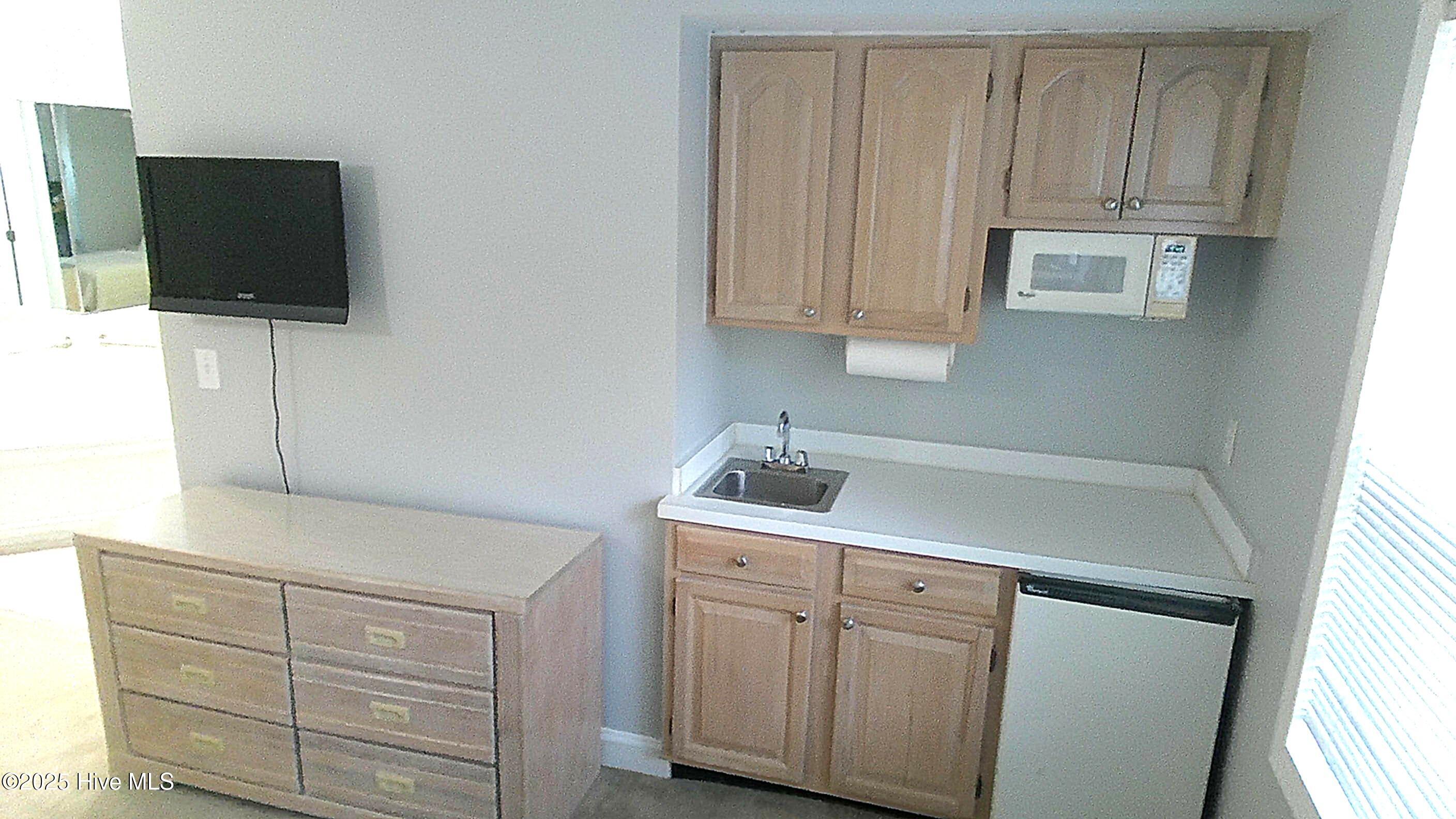 908 Resort Circle, Unit 108 Sunset Beach, NC 28468 - Photo 8 of 36 kitchenette in lockout