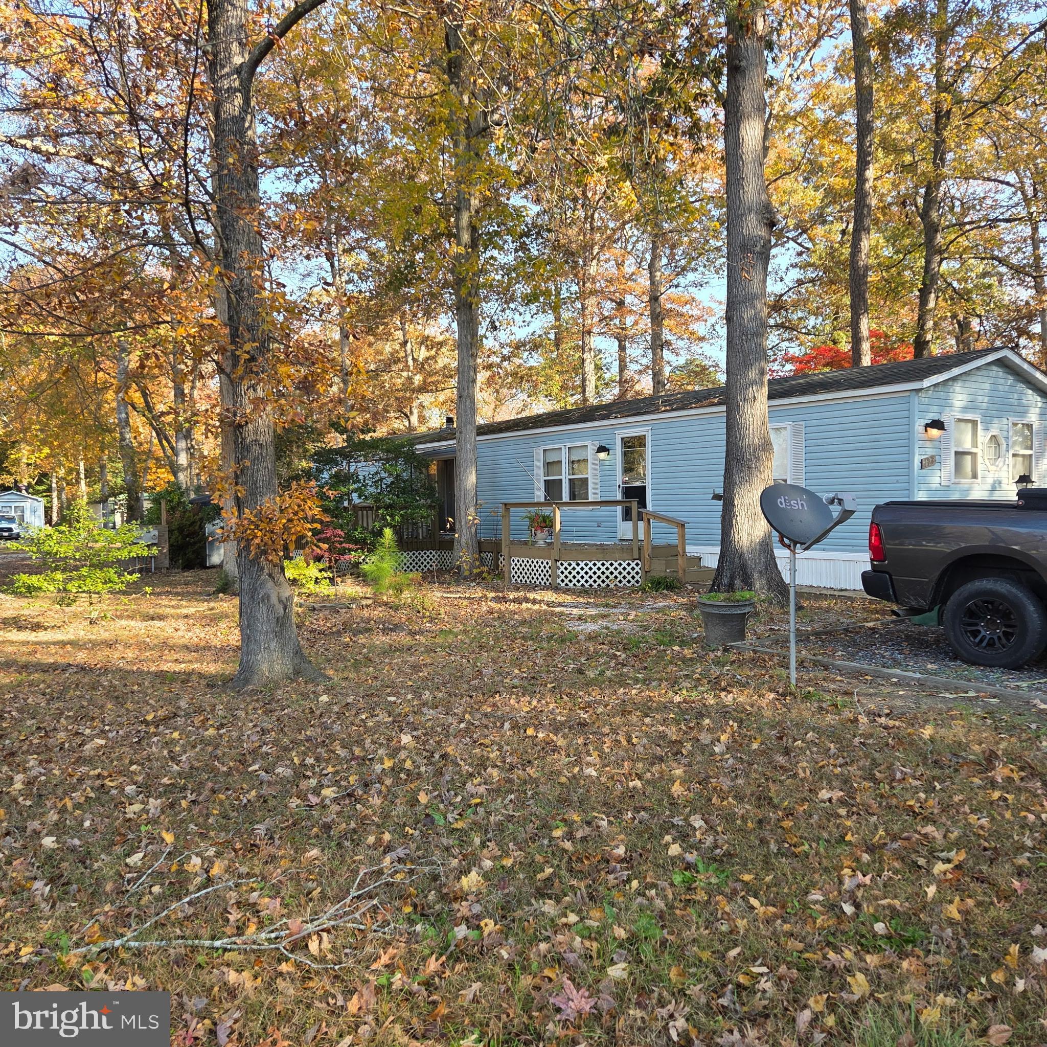 12623 Shell Mill Road, Unit 123 Bishopville, MD 21813 - Photo 1 of 15 a house view with a garden space