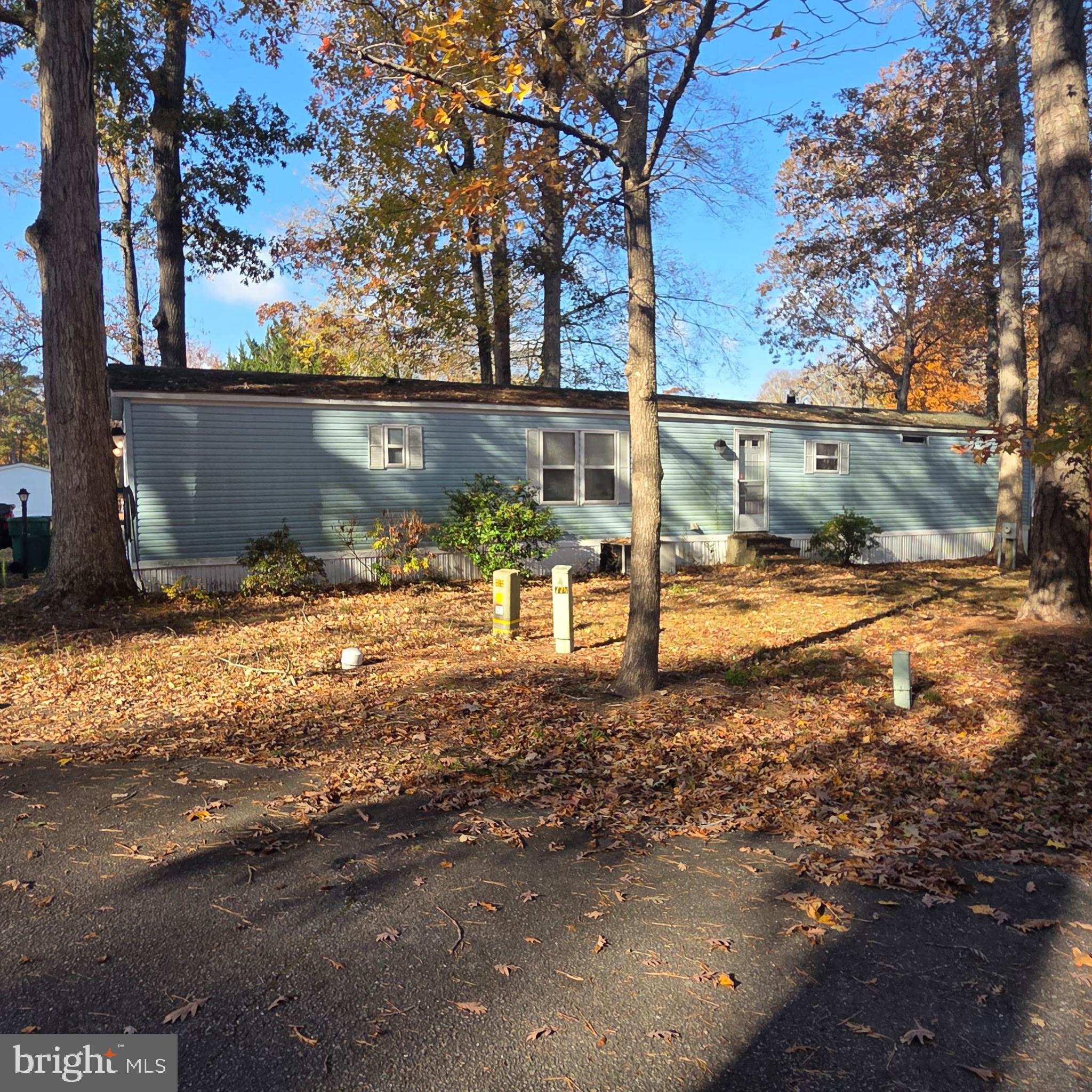 12623 Shell Mill Road, Unit 123 Bishopville, MD 21813 - Photo 12 of 15 a view of a yard covered with snow in the road