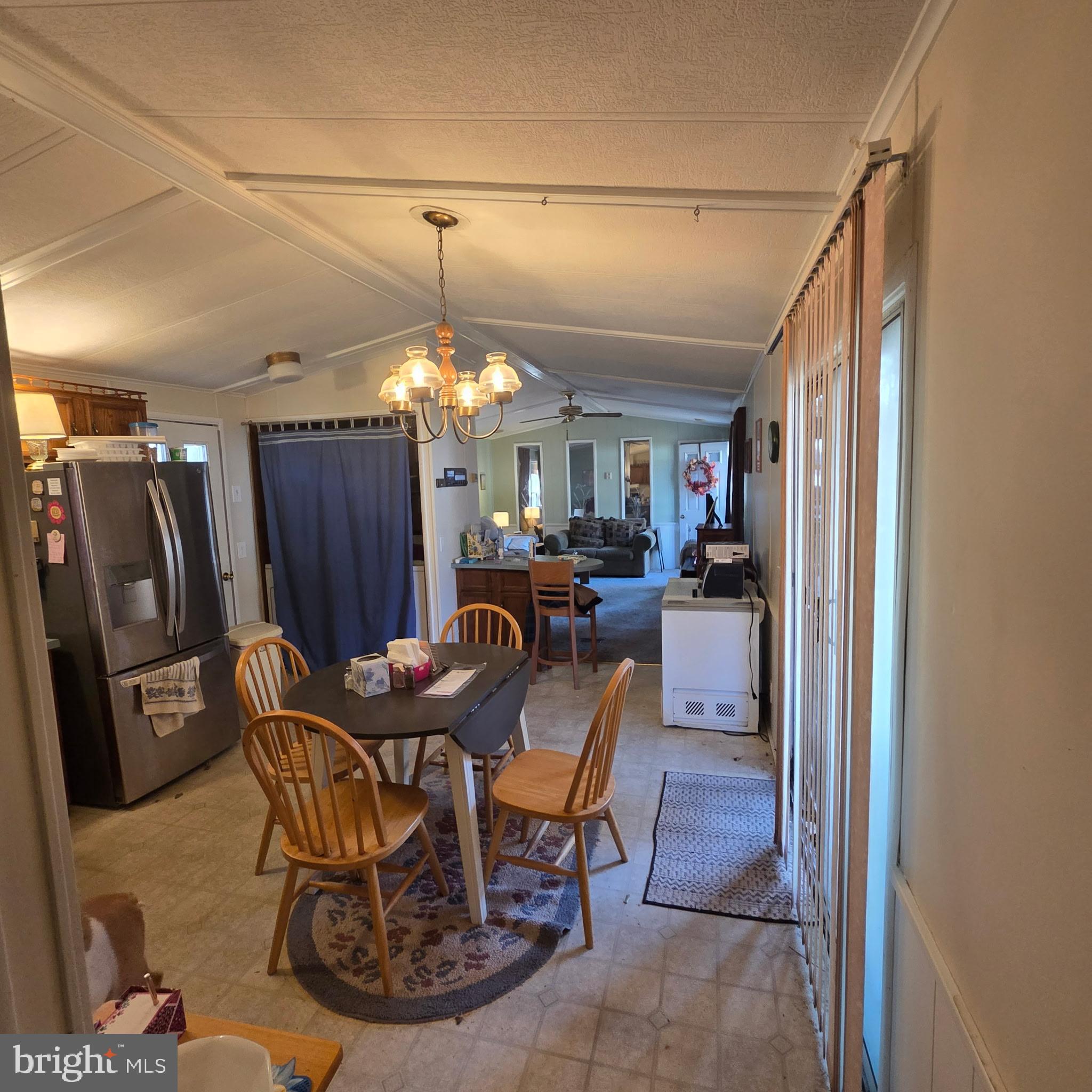 12623 Shell Mill Road, Unit 123 Bishopville, MD 21813 - Photo 13 of 15 a view of a dining room with furniture