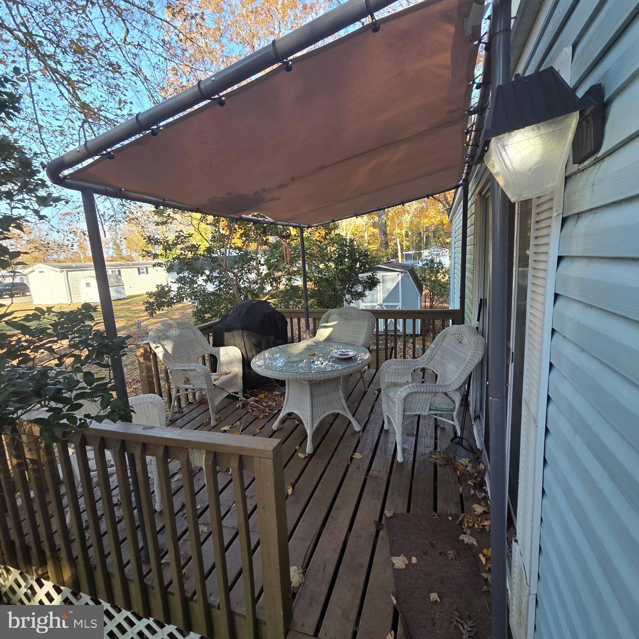 12623 Shell Mill Road, Unit 123 Bishopville, MD 21813 - Photo 3 of 15 a view of a balcony with furniture