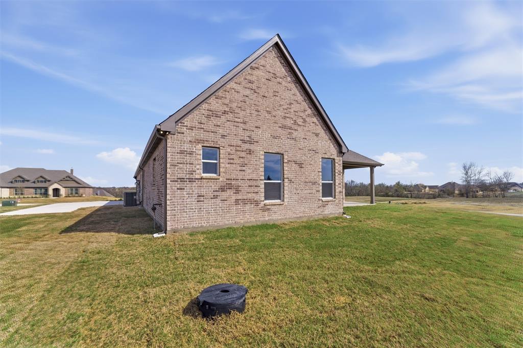 814 Vly Rdg Road Van Alstyne, TX 75495 - Photo 22 of 24 a view of a house with a yard