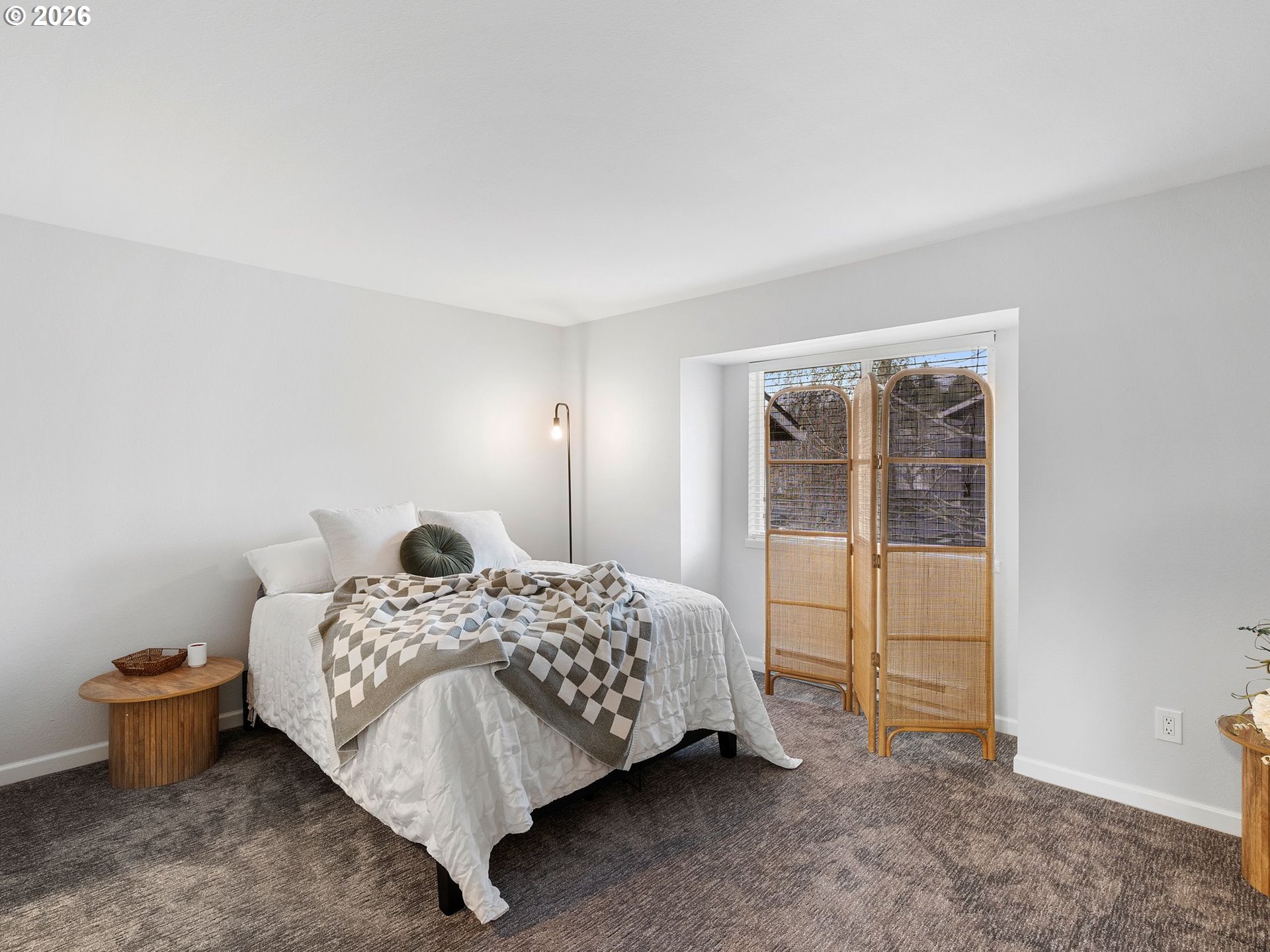 9370 Southwest 146th Terrace, Unit N5 Beaverton, OR 97007 - Photo 15 of 35 a bedroom with a bed and wooden floor