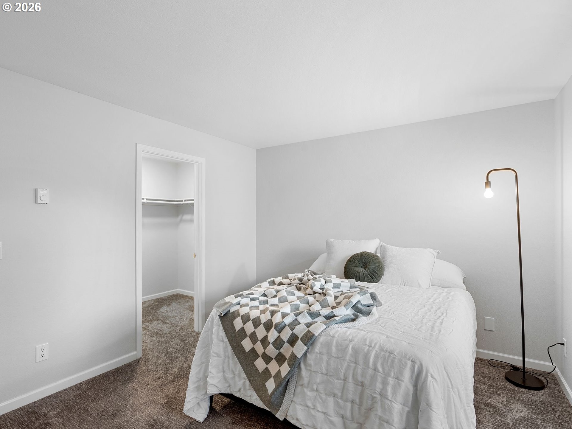 9370 Southwest 146th Terrace, Unit N5 Beaverton, OR 97007 - Photo 16 of 35 a bedroom with a bed and wooden floor