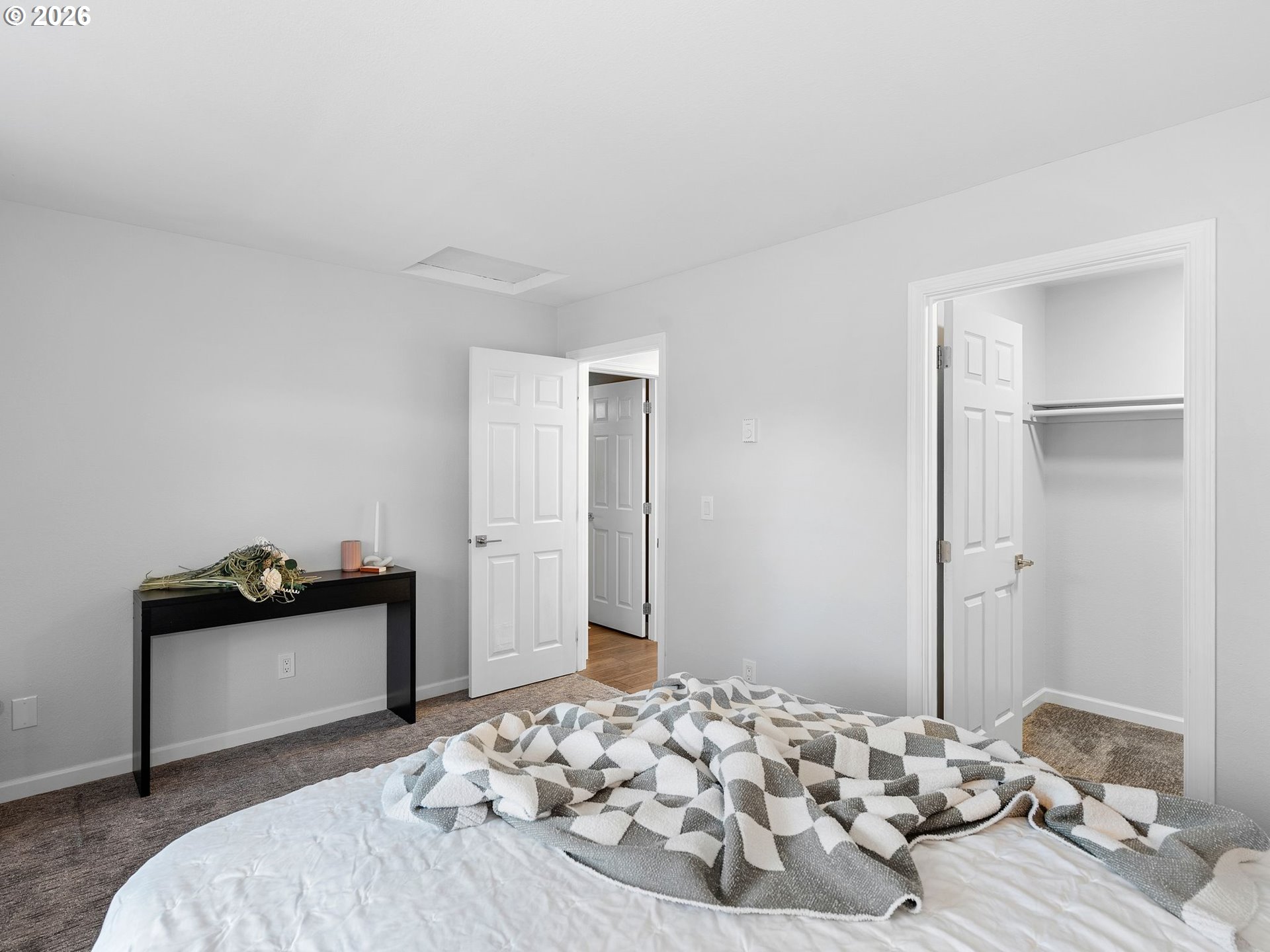 9370 Southwest 146th Terrace, Unit N5 Beaverton, OR 97007 - Photo 17 of 35 a bedroom with a bed and wooden floor