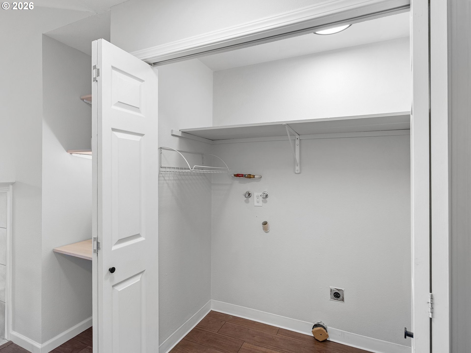 9370 Southwest 146th Terrace, Unit N5 Beaverton, OR 97007 - Photo 19 of 35 a view of walk in closet with empty racks