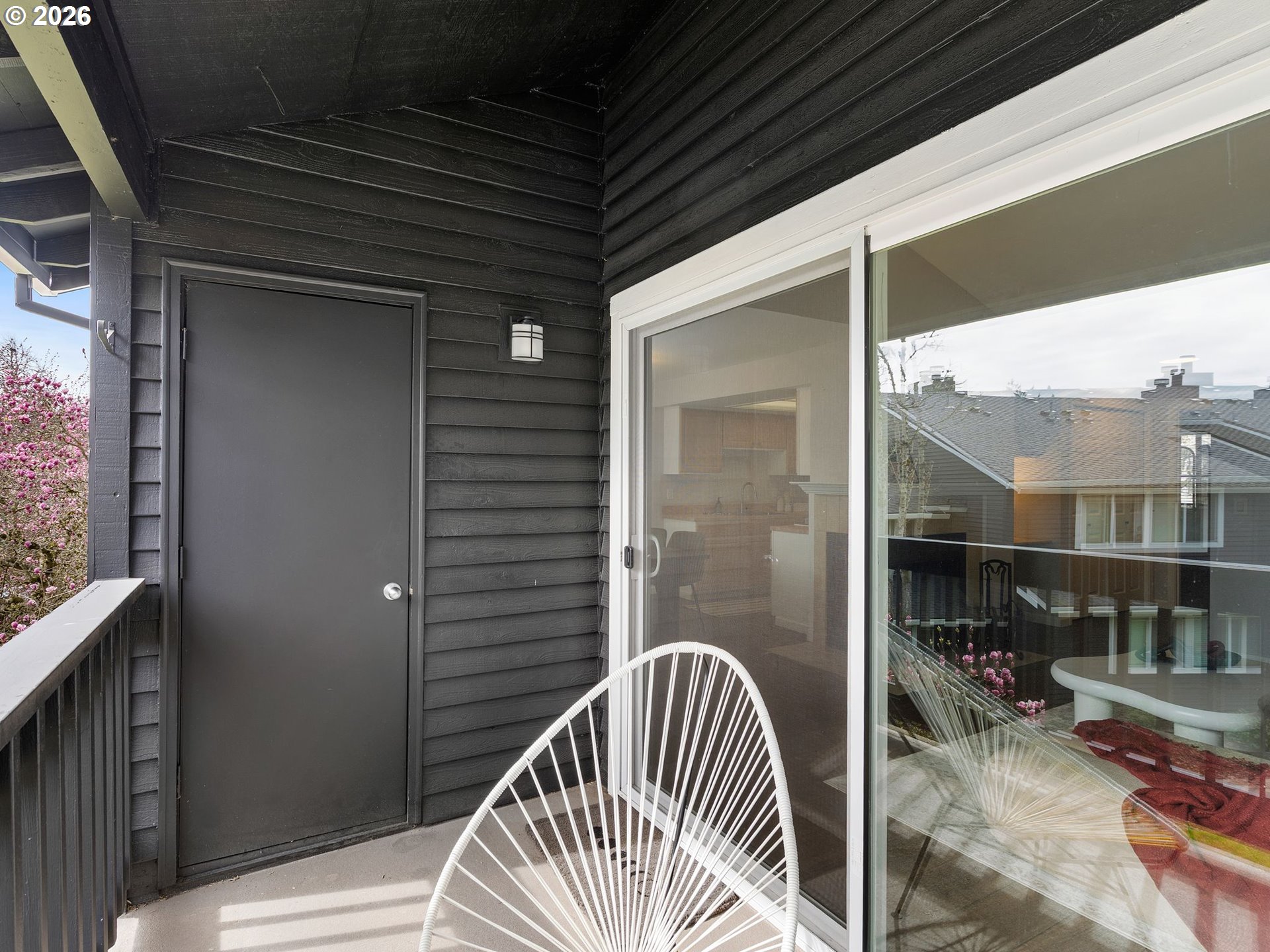9370 Southwest 146th Terrace, Unit N5 Beaverton, OR 97007 - Photo 22 of 35 a view of balcony with furniture