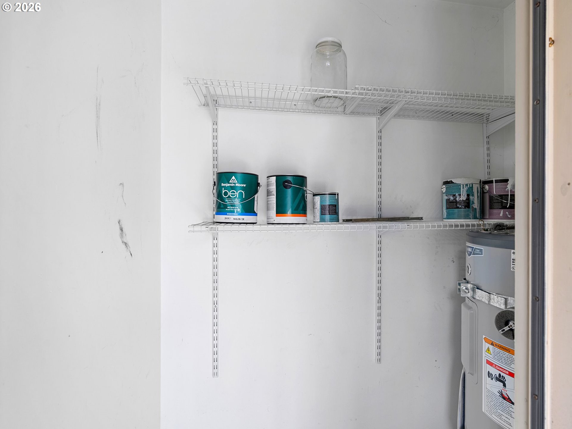 9370 Southwest 146th Terrace, Unit N5 Beaverton, OR 97007 - Photo 23 of 35 a kitchen with cabinets and wooden floor
