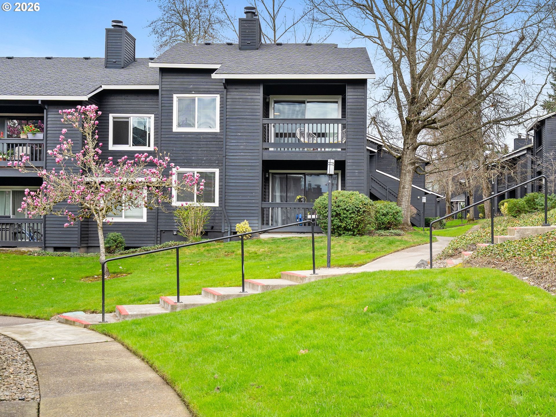 9370 Southwest 146th Terrace, Unit N5 Beaverton, OR 97007 - Photo 25 of 35 a house that has a garden in front of it