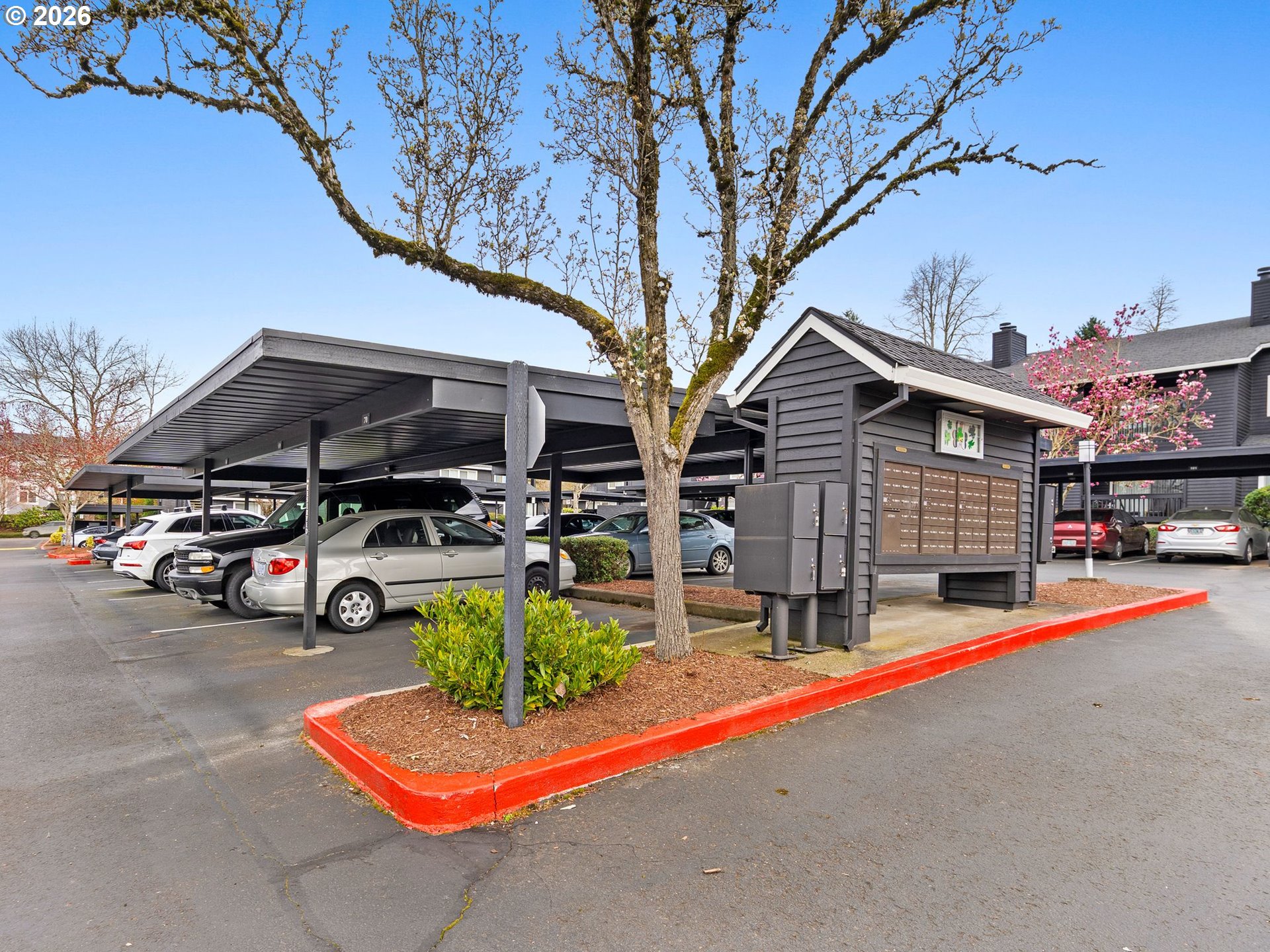 9370 Southwest 146th Terrace, Unit N5 Beaverton, OR 97007 - Photo 28 of 35 a view of a car park in front of house