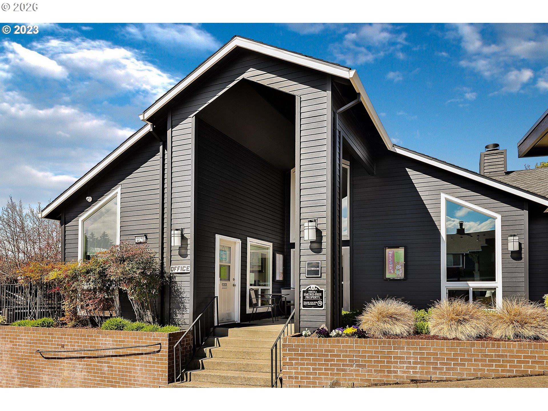 9370 Southwest 146th Terrace, Unit N5 Beaverton, OR 97007 - Photo 29 of 35 a front view of a house with a yard