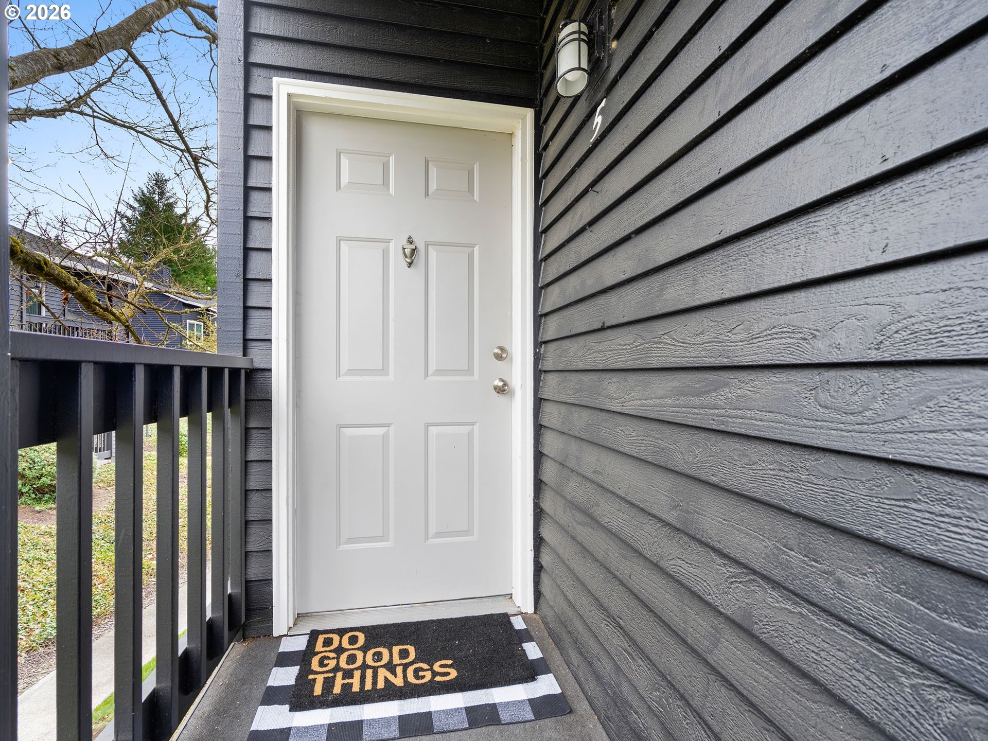 9370 Southwest 146th Terrace, Unit N5 Beaverton, OR 97007 - Photo 3 of 35 a view of a entryway door with wooden floor