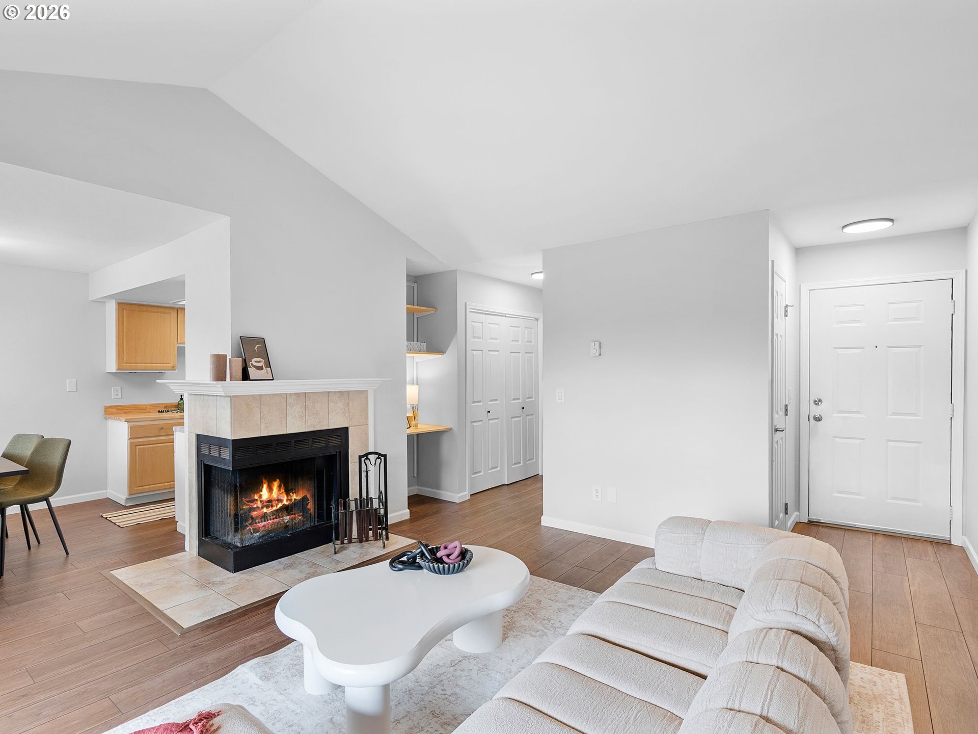 9370 Southwest 146th Terrace, Unit N5 Beaverton, OR 97007 - Photo 5 of 35 a living room with furniture and a fireplace