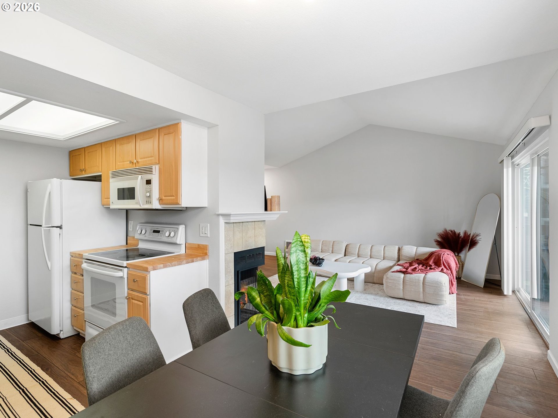 9370 Southwest 146th Terrace, Unit N5 Beaverton, OR 97007 - Photo 9 of 35 a living room with furniture flowerpot and a potted plant