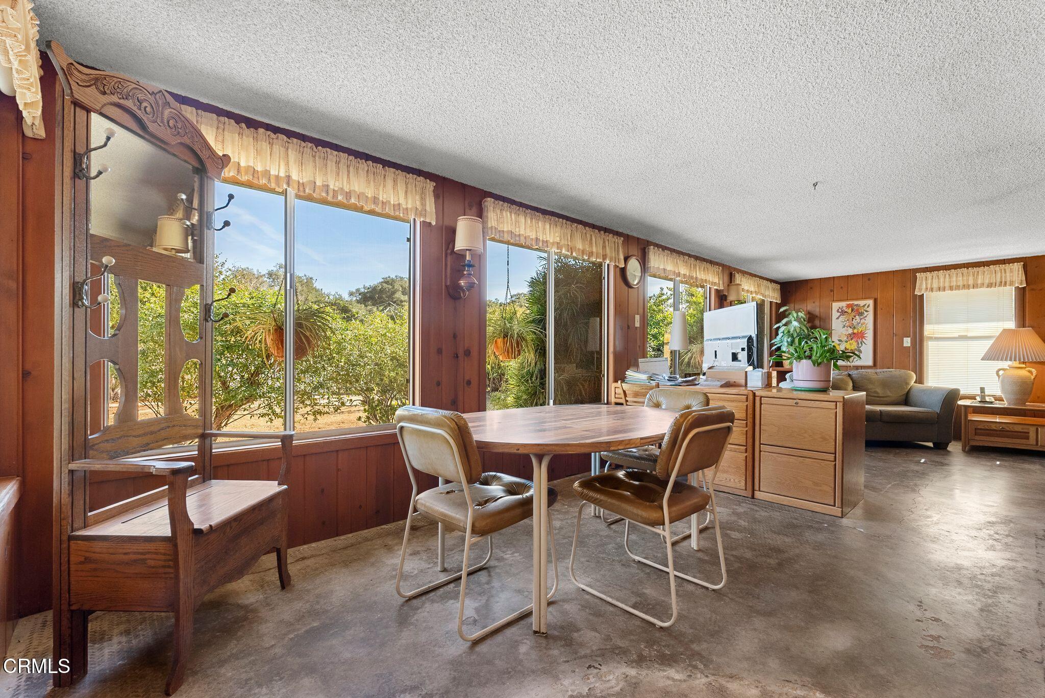 830 South Rice Road Ojai, CA 93023 - Photo 28 of 39 a dining room with furniture and a floor to ceiling window
