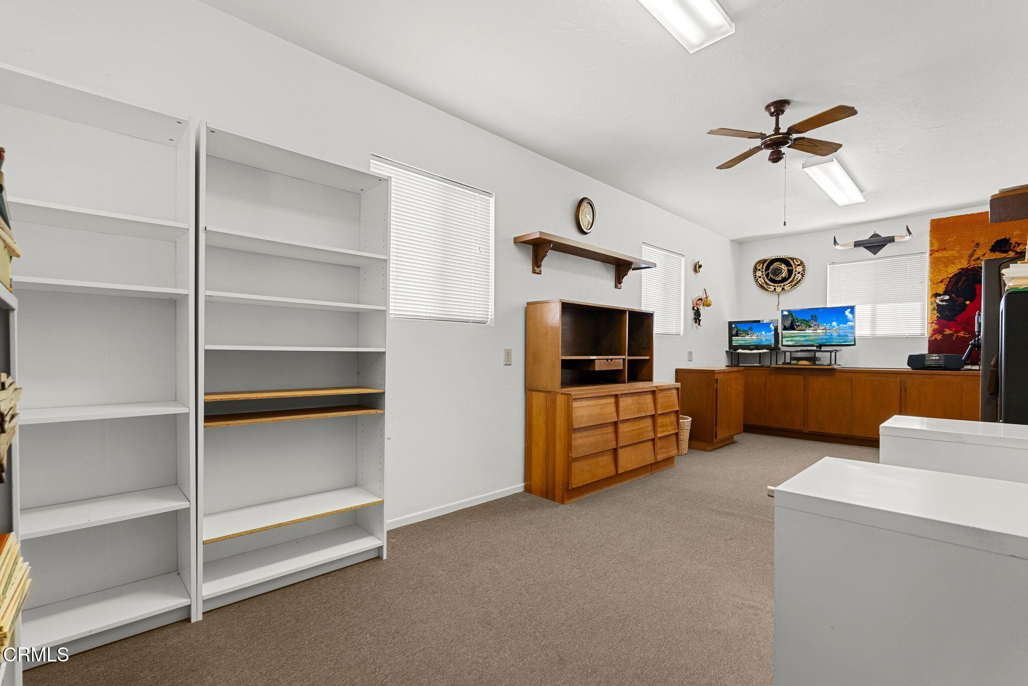830 South Rice Road Ojai, CA 93023 - Photo 36 of 39 a living room with furniture and a flat screen tv