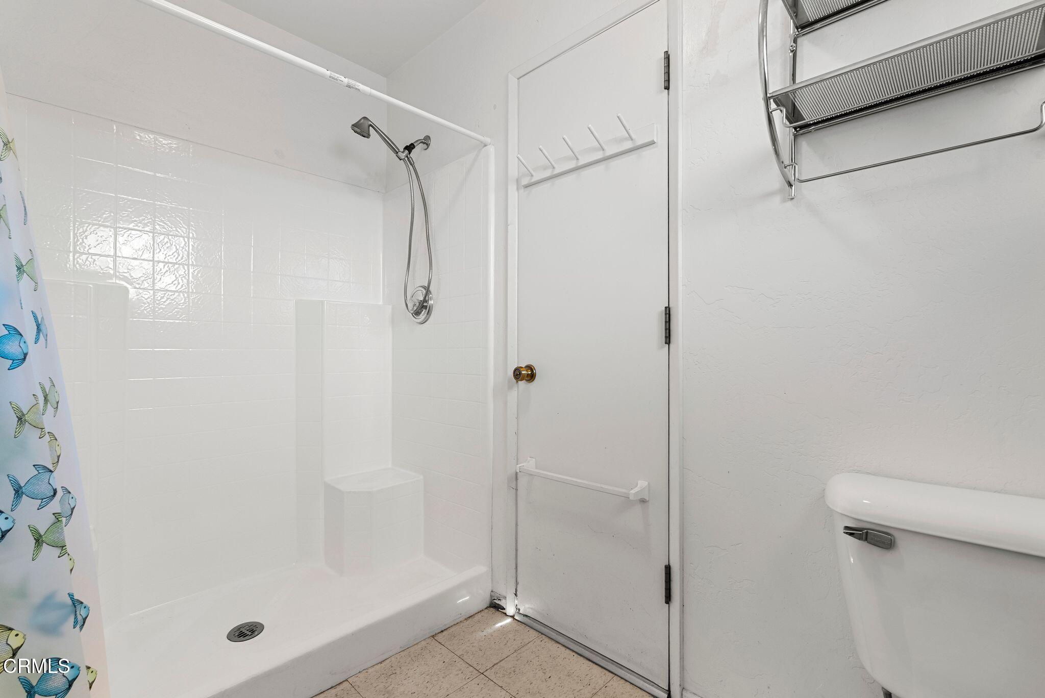830 South Rice Road Ojai, CA 93023 - Photo 39 of 39 a bathroom with a glass shower door