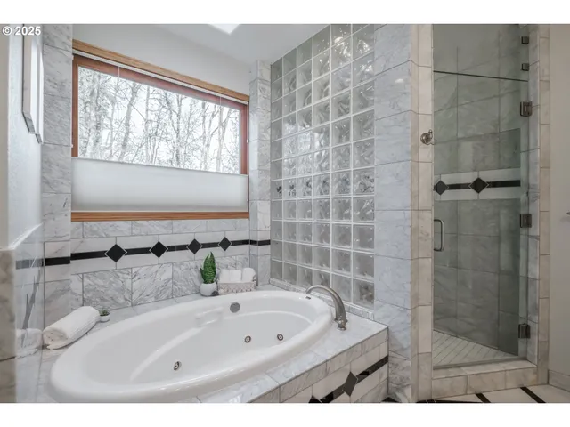 a bathroom with a tub sink and shower