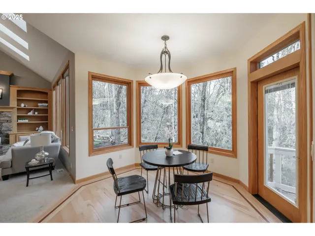 a dining room with furniture window and outside view