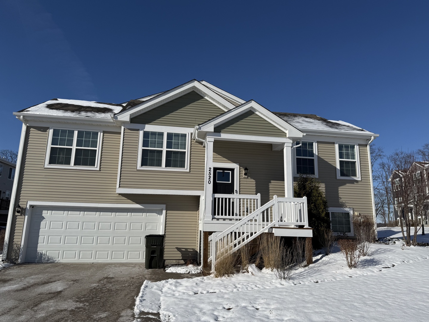 a front view of a house with yard