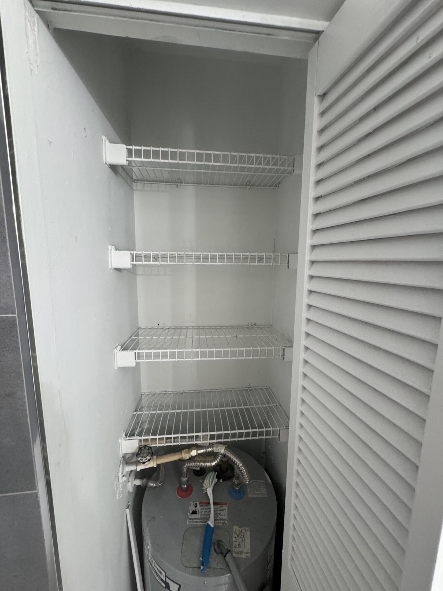 1854 Abbey Road, Unit 102 West Palm Beach, FL 33415 - Photo 13 of 26 Bathroom Closet