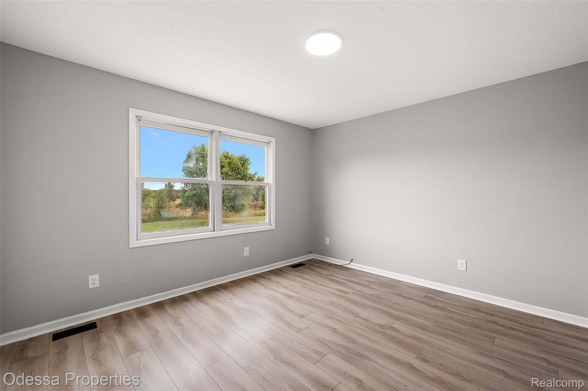 1442 Riley Center Road Memphis, MI 48041 - Photo 36 of 62 Empty room with light wood-type flooring and baseboards