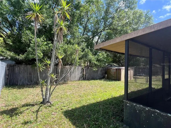 a view of a backyard with a small cabin