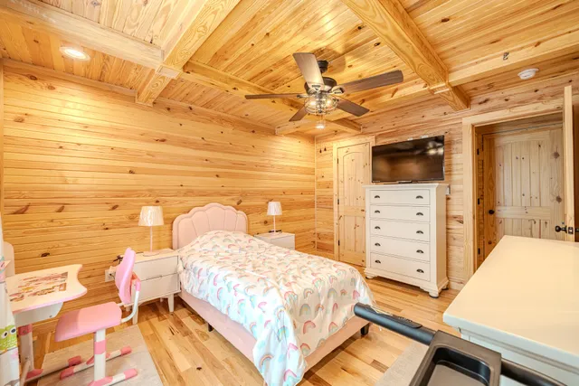 a bedroom with a bed and a view of walk in closet