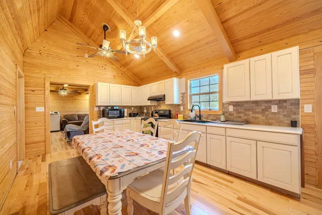 a kitchen with a sink and cabinets