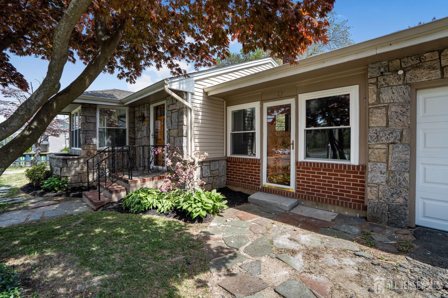 569 Holmdel Road Hazlet, NJ 07730 - Photo 3 of 26 a front view of a house with garden