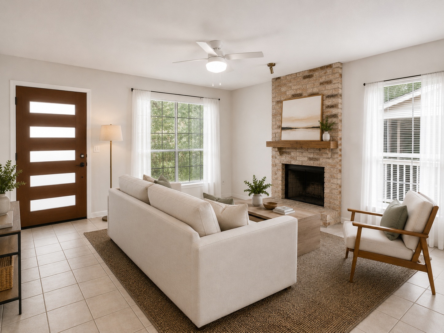 1707 Waterloo Trail, Unit A Austin, TX 78704 - Photo 3 of 8 A cozy living space features a charming brick fireplace, providing warmth and character.