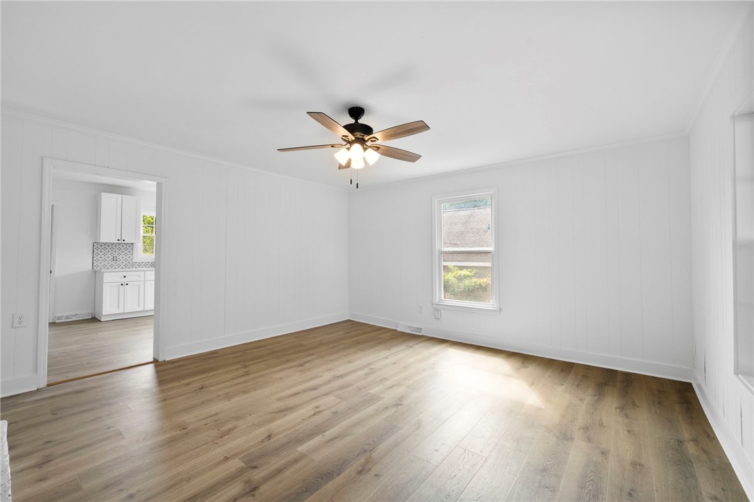 201 South 8th Street Easley, SC 29640 - Photo 22 of 28 Gleaming wood-look floors anchor this versatile room offering a direct view into the kitchen.