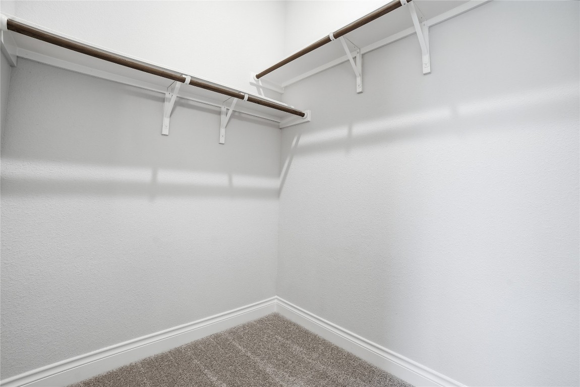 716 Coppell Court Leander, TX 78641 - Photo 32 of 40 a view of a room with racks on the wall