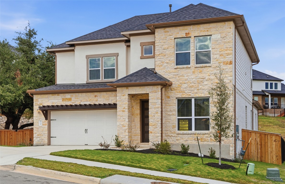 716 Coppell Court Leander, TX 78641 - Photo 4 of 40 a front view of a house with garden