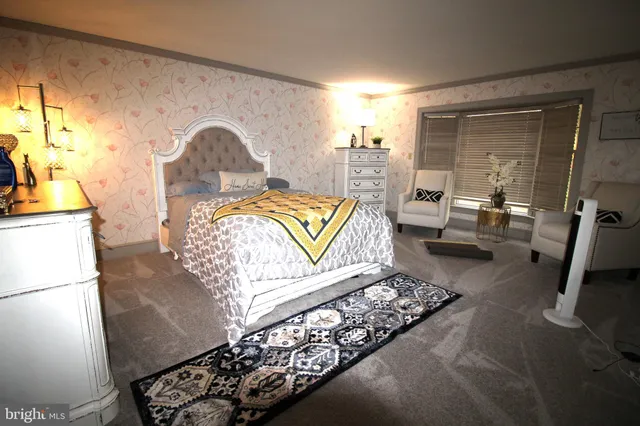 a spacious bathroom with a double vanity sink a mirror and a bathtub