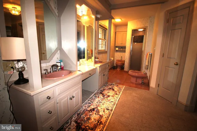 wooden floor with a bathroom