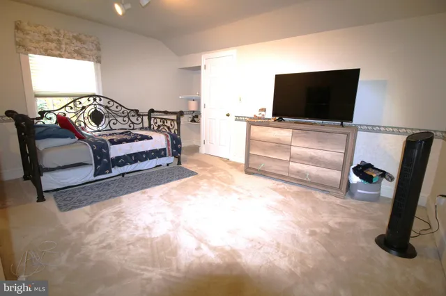 a bathroom with a sink a mirror and a shower